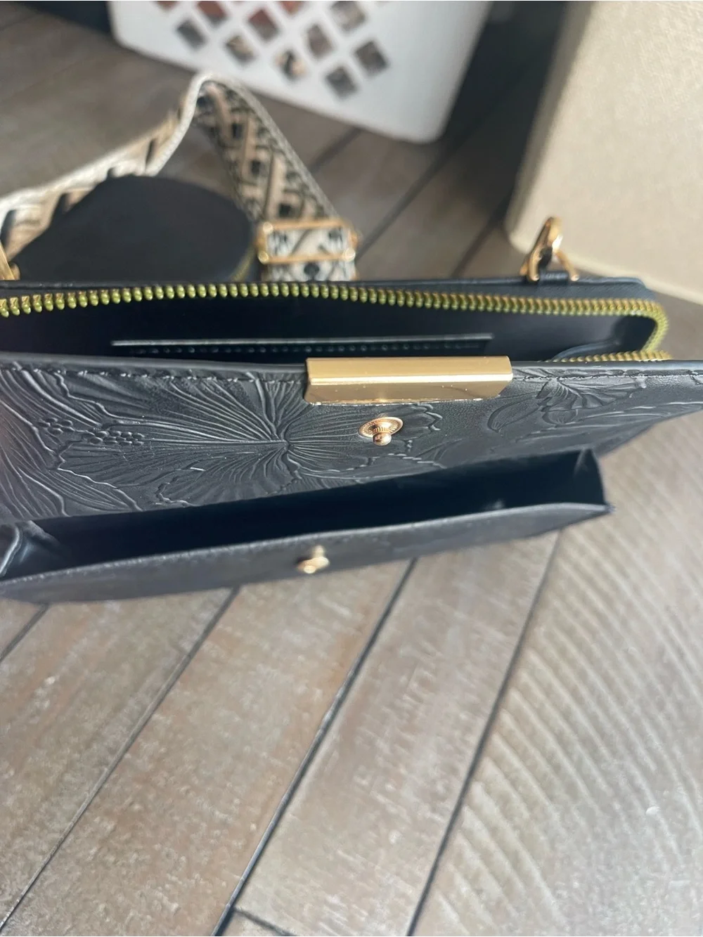 Black Embossed Crossbody Wallet with Patterned Strap and Coin Pouch